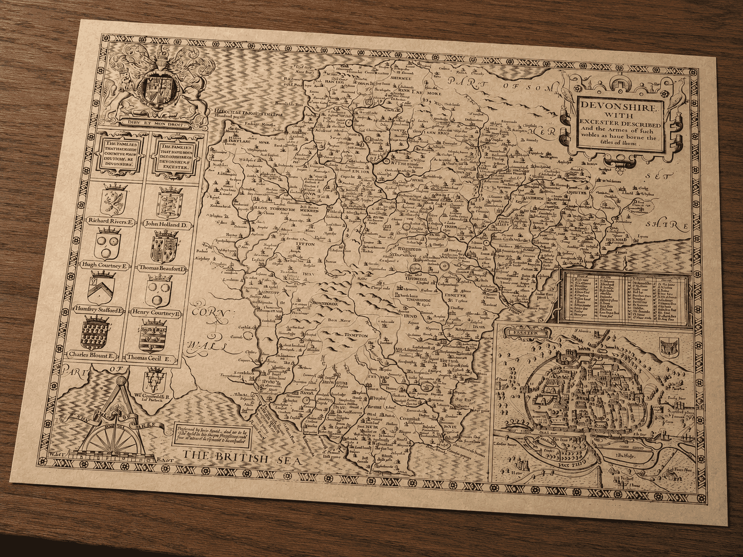 John Speed’s Devon map print displayed on a desk