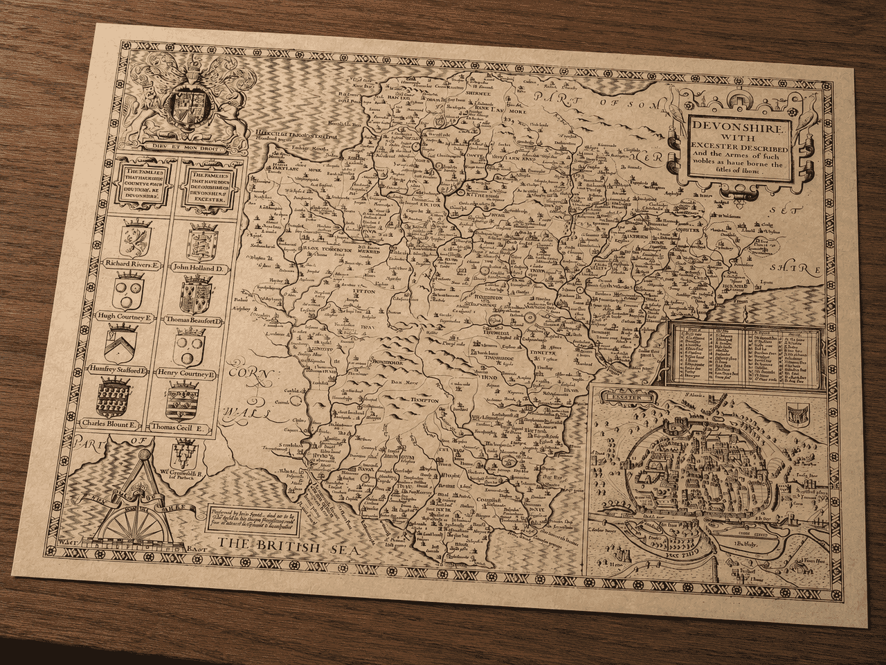 John Speed’s Devon map print displayed on a desk