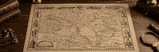 Antique map of Hungary displayed on a wooden desk