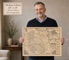 Model holding the medium edition of John Speed’s historic map of Herefordshire for size illustration