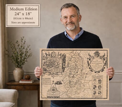 Model holding the medium edition of John Speed’s historic map of Nottinghamshire for size illustration