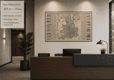 Old Britain Map by George Willdey shown at 46 × 30 inches in a thin frame in an office reception