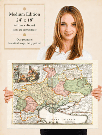 Woman holding the medium edition of Homann’s old map of Ukraine for size illustration