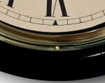 Detail of Brass Bezel Black Clock Case