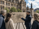 Tour guide using old map.
