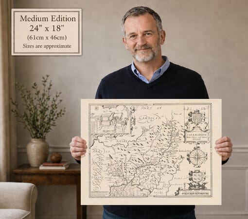 Model holding the Medium Edition old map of Carmarthenshire