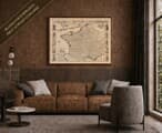 Old map of France shown framed on a living-room wall